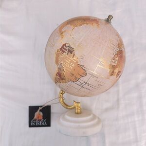white decorative gold globe